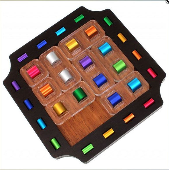 Slide Elox by Jean-Claude Constantin is an intricate mechanical puzzle featuring a wooden base with colorful cylindrical pieces arranged in clear compartments, designed for challenging and engaging gameplay.