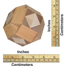 A mechanical puzzle named Cross in Ball, made by VINCO. The puzzle features multiple geometric shapes and is crafted from various types of wood. It is shown with measurement markings in inches and centimeters for size reference.