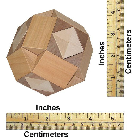 A mechanical puzzle named Cross in Ball, made by VINCO. The puzzle features multiple geometric shapes and is crafted from various types of wood. It is shown with measurement markings in inches and centimeters for size reference.