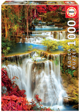 Educa jigsaw puzzle featuring a beautiful waterfall cascading through a lush deep forest. The scene is enriched with vibrant autumn foliage and serene water. Perfect for puzzle enthusiasts and nature lovers alike.