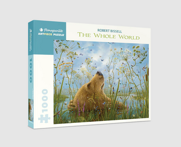 Jigsaw puzzle box featuring Robert Bissell's artwork 'The Whole World.' The design showcases a bear surrounded by colorful flowers and wildlife under a blue sky, enticing nature lovers and puzzle enthusiasts.