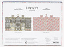 Liberty London Tudor Building 750 Piece Jigsaw Puzzle by Galison. Features a detailed illustration of the iconic Tudor-style architecture on the front, and a beautiful floral design on the back. Measuring 27 x 17.75 inches when completed, this double-sided puzzle offers a unique 2-in-1 experience, perfect for puzzle enthusiasts and fans of intricate designs.