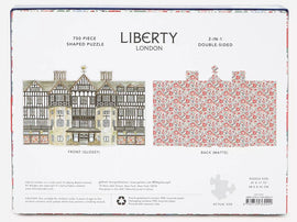 Liberty London Tudor Building 750 Piece Jigsaw Puzzle by Galison. Features a detailed illustration of the iconic Tudor-style architecture on the front, and a beautiful floral design on the back. Measuring 27 x 17.75 inches when completed, this double-sided puzzle offers a unique 2-in-1 experience, perfect for puzzle enthusiasts and fans of intricate designs.