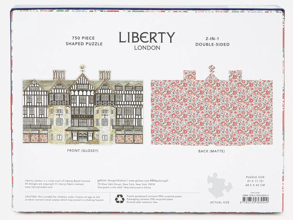 Liberty London Tudor Building 750 Piece Jigsaw Puzzle by Galison. Features a detailed illustration of the iconic Tudor-style architecture on the front, and a beautiful floral design on the back. Measuring 27 x 17.75 inches when completed, this double-sided puzzle offers a unique 2-in-1 experience, perfect for puzzle enthusiasts and fans of intricate designs.