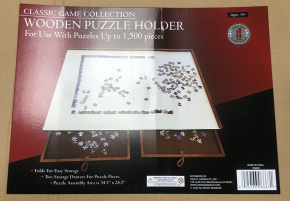 The Wooden Puzzle Holder by John N. Hansen is designed for jigsaw puzzles up to 1,500 pieces. It features an assembly area measuring 34.5 x 24.5 inches, with two storage drawers for easy organization of puzzle pieces. The holder folds for easy storage, making it a perfect solution for puzzle enthusiasts.