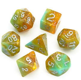 A set of seven colorful RPG dice from the Hobbit House RPG Dice Set by Foam Brain Games. The dice feature a mix of green and orange translucent colors with sparkles, clearly marked numbers, including d20, d12, d10, d8, d6, and d4 shapes, perfect for tabletop gaming.