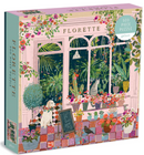Florette jigsaw puzzle illustration featuring a charming indoor garden scene with various plants, colorful flower pots, a playful cat, a dog wearing a floral collar, and cozy decor elements. The box displays the title 'Florette' prominently with a vibrant design, inviting puzzle enthusiasts.