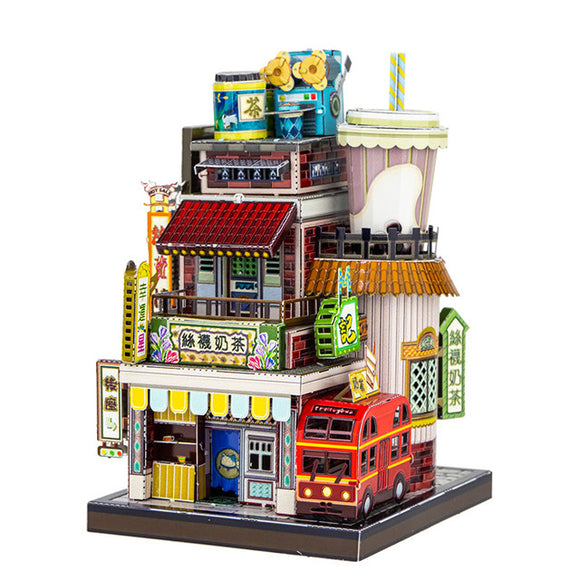 A colorful DIY model kit of the 'Travel the World Milk Tea Shop' by Mu Model. The intricate design features a multi-level tea shop with decorative signage, windows, a rooftop with tea canisters, and a vibrant red delivery truck parked in front. The model beautifully captures the essence of a busy milk tea shop, showcasing various architectural details and bright colors, perfect for crafting enthusiasts.