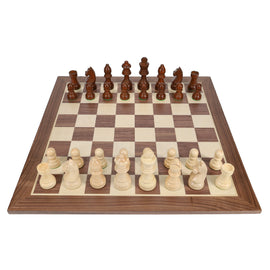 A 15-inch wooden chess set featuring Staunton-style chessmen with a 3-inch king piece. The board displays alternating light and dark squares, with intricately carved wooden pieces ready for play.