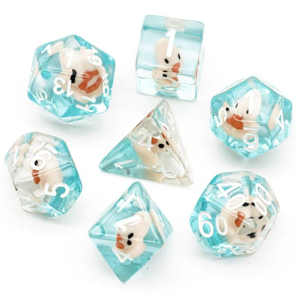 A vibrant Pink Duck RPG Dice Set by Foam Brain featuring a collection of seven unique polyhedral dice. Each die is semi-transparent blue with playful pink duck designs encapsulated within, making them perfect for tabletop gaming. The set includes various shapes, such as d4, d6, d8, d10, d12, d20, and d00 dice to enhance your gaming experience.