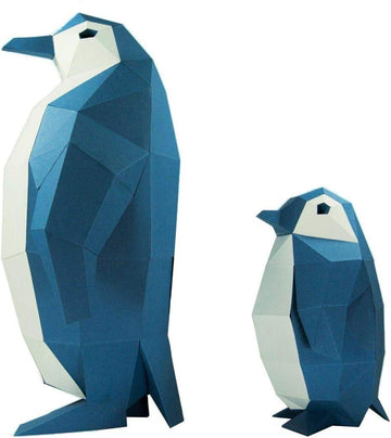A 3D papercraft model of two penguins, one larger and one smaller, made of colorful geometric shapes primarily in blue and white. The design features a sleek, modern aesthetic, showcasing the angles and facets typical of origami art. Ideal for DIY enthusiasts, this kit enables creators to assemble the penguin models for display or educational purposes.