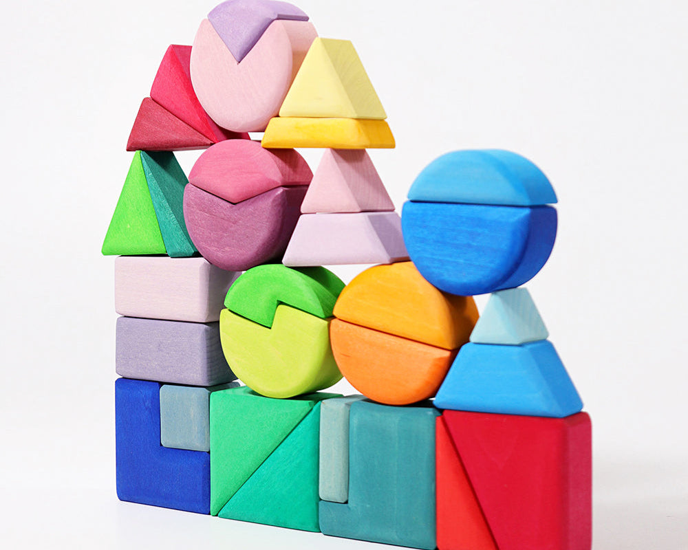 A tower of multi-colored blocks in various shapes. 