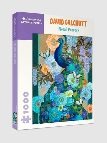 Jigsaw puzzle titled 'Floral Peacock' by David Galchutt, featuring a vibrant peacock adorned with flowers and butterflies against a colorful background. The packaging indicates it's a 1000-piece puzzle from Pomegranate.