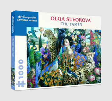The Tamer jigsaw puzzle by Olga Suvorova, featuring a vibrant and intricate design with various animals including leopards, peacocks, and lush flowers. The box displays the title and the artist's name against a colorful backdrop.