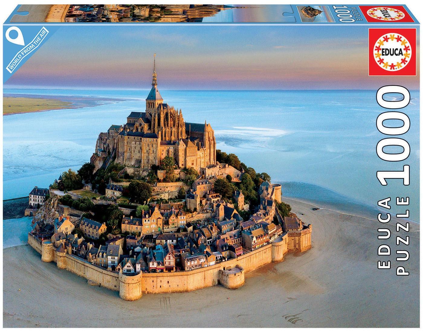 Mont-Saint Michel jigsaw puzzle by Educa featuring a stunning aerial view of the iconic island commune with its medieval architecture surrounded by sandy beaches and shimmering waters. The puzzle contains 1000 pieces, perfect for enthusiasts of all ages who enjoy building intricate designs.