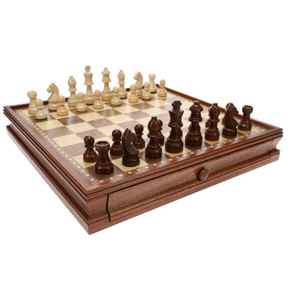 A beautifully crafted wooden chess set featuring a 3.5-inch king piece. The board has a decorative border and is arranged with all pieces in place, showcasing both light and dark wood tones. Perfect for chess enthusiasts and collectors.