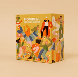 Monikers: Serious Nonsense is a colorful party game box featuring various illustrated characters engaged in fun activities. The design includes energetic people and whimsical elements, making it appear vibrant and inviting. The packaging is bright yellow, adorned with playful illustrations that suggest a lighthearted and entertaining gameplay experience.