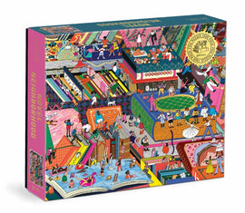 The Novel Neighborhood jigsaw puzzle by Galison includes a vibrant and detailed illustration featuring various colorful scenes of people interacting and engaging in activities within a neighborhood setting. The puzzle box showcases playful artwork that invites creativity and exploration among puzzle enthusiasts. Perfect for family game night or solo relaxation.