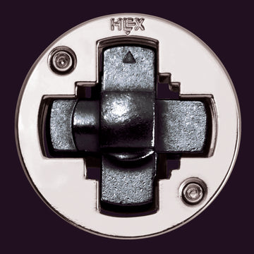 The Cast Hex is a mechanical puzzle featuring a circular design with a metallic finish. It has a center puzzle piece that rotates and interlocks with surrounding parts, designed to challenge the mind. Ideal for puzzle enthusiasts and a stylish addition to any collection.