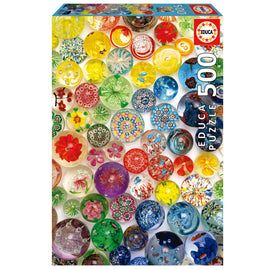 Educa DREAM BUBBLES jigsaw puzzle packaging featuring a vibrant array of colorful decorative bubbles and flowers in various shapes and designs. The box displays a total of 500 pieces, inviting puzzlers to immerse themselves in a fun and engaging activity.