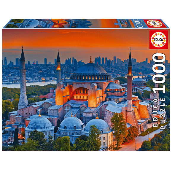 Educa jigsaw puzzle featuring the stunning Blue Mosque in Istanbul, beautifully illuminated at sunset, with intricate architectural details and a vibrant skyline in the background. The puzzle contains 1000 pieces, making it a rewarding challenge for enthusiasts.