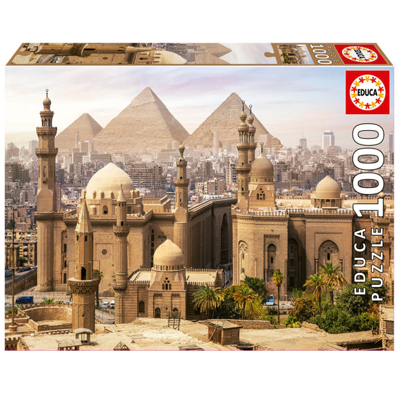 Educa jigsaw puzzle featuring a stunning view of Cairo, Egypt, with the Pyramids in the background and intricate architectural details of historic buildings. The puzzle consists of 1000 pieces, providing a challenging and rewarding experience for puzzle enthusiasts.