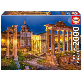 Box packaging of the 2000-piece jigsaw puzzle featuring a detailed and vibrant image of the Roman Forum at night, with ancient ruins and historical architecture illuminated beautifully.