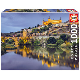 Educa TOLEDO 1000PC jigsaw puzzle featuring a beautiful landscape of Toledo, Spain at dusk, showcasing a picturesque reflection in the river. Perfect for puzzle enthusiasts and a great way to explore the beauty of this historic city.