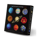 Crocodile Creek Solar System Jigsaw Puzzle featuring vivid images of the planets, including Earth, Saturn, and Mars. The puzzle box displays a colorful collage of celestial bodies, perfect for educational fun. Great for kids and space enthusiasts to engage in learning about the solar system through play.