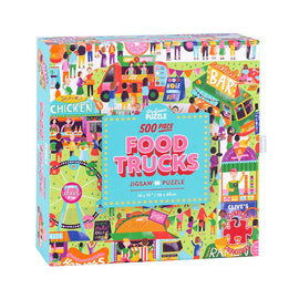 Colorful jigsaw puzzle titled 'Food Trucks' by Professor Puzzle. The 500-piece puzzle box features vibrant illustrations of various food trucks, vendors, and carnival activities, showcasing an array of foods including chicken and tacos. Dimensions of the puzzle are 14 x 19 inches (36 x 48 cm).
