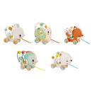 A colorful assortment of five wooden animal pull toys by Janod, featuring a rabbit, a bear, a chick, a fox, and a turtle. Each toy is designed with playful, friendly faces and includes a string for pulling.