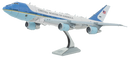 A detailed metal model of Air Force One, featuring intricate designs and a stand for display. The aircraft is painted with the iconic blue and white color scheme, showcasing 'United States of America' on its side. Perfect for enthusiasts and collectors.