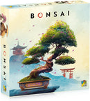 Bonsai game box by DV GIOCHI featuring an artistic illustration of a bonsai tree in a decorative pot against a serene background of a temple and cherry blossom petals falling. The title "Bonsai" is prominently displayed on the front, with vibrant colors emphasizing the beauty of nature and craftsmanship.