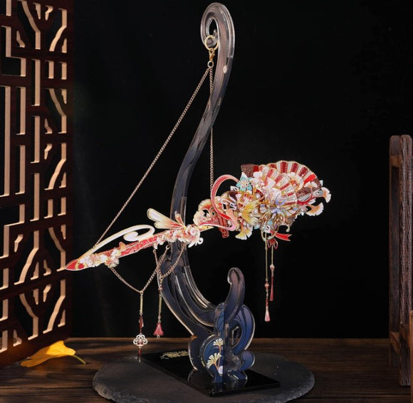 A beautifully crafted hanger display for a Hairpin Sword Metal Model, featuring an elegant black and gold stand with intricate designs. The display showcases vibrant colors and decorative elements, ideal for collectors and DIY enthusiasts. Perfect for showcasing models in a stylish manner.