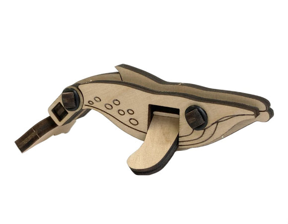 A wooden DIY kit featuring a whale design, the Loopets Whale by Zootility. This intricate model showcases natural wood grain and detailed engraving with movable parts, providing a fun and educational crafting experience.