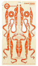 JCR Work's Mollusca Giant Squid DIY kit features intricately designed cutouts of a giant squid in bright orange. The kit includes detailed instructions and is crafted from durable material, perfect for creative projects and educational purposes.
