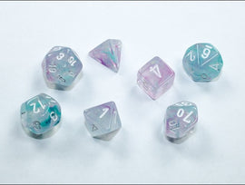 A colorful set of eight Mini Nebula RPG dice in Wisteria and White, featuring a mix of transparent and opaque designs with shimmering hues of purple and white. The set includes various shapes: a d20, d12, d10s, d8, d6, d4, and a pyramid-shaped die, all with clear, readable numbers.
