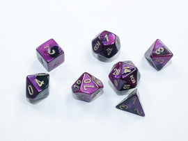 A set of Mini Gemini RPG dice featuring a black and purple color scheme with gold numbering. The seven dice include different shapes suitable for tabletop gaming.