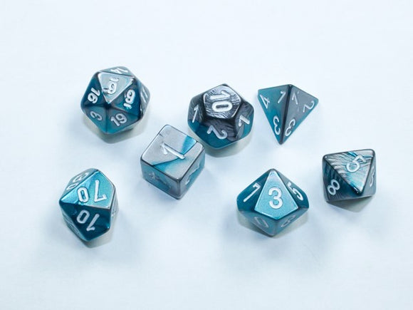A collection of eight Mini Gemini RPG dice featuring a beautiful steel-teal and white color scheme. The set includes various polyhedral dice, such as d20, d12, d10, d8, d6, and d4, all showcasing clear numerals for easy readability. The unique and vibrant colors make this set ideal for tabletop gaming enthusiasts.