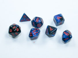 A set of black-starlight mini RPG dice from Chessex, featuring a sparkling blue and black finish with red numbered faces. The set includes various shapes such as a d20, d12, d10, d8, d6, and d4, ideal for tabletop gaming.
