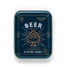 Packaging of Beer Playing Cards by Gentlemen's Hardware featuring a dark blue design with the words 'Beer Trivia' in bold white letters. The design is adorned with a hop illustration and decorative elements, highlighting the waterproof quality of the cards.