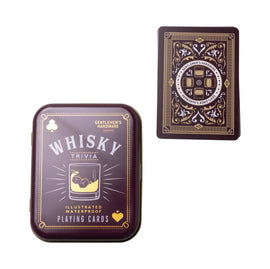 A stylish tin featuring the title 'Whisky Trivia' on the front, alongside beautifully designed waterproof playing cards. The tin is dark purple with gold accents, including a graphic of a whisky glass and ice. The playing card shows intricate detailing on the back, featuring elements related to whisky.