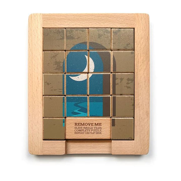 Wood Sliding Puzzle Day & Night by Trove, featuring a 16-tile mechanical puzzle with a graphic of a moonlit scene. The puzzle is set in a natural wood frame and includes a removable instruction block, encouraging players to slide image tiles to complete the puzzle and repeat on the flip side, showcasing dual designs for added fun.