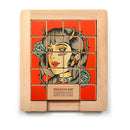 Wood Sliding Puzzle 'Naughty & Nice' by Trove features a colorful mechanical puzzle with a stylish illustration of a woman. The design includes sliding image tiles that challenge players to rearrange and complete the picture. The puzzle is made from natural wood, offering a tactile and engaging experience. It promotes cognitive skills and hand-eye coordination, making it perfect for puzzle enthusiasts and families alike.