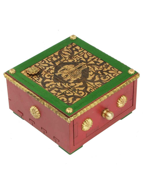 The Elefanten Puzzle Box by Jean Claude is a beautifully crafted mechanical puzzle. This decorative box features a vibrant red and green exterior, intricately designed lid with a classic motif, and golden embellishments that enhance its aesthetic appeal. It includes a functional drawer that can be unlocked through a clever mechanism, offering both a challenging puzzle experience and a delightful storage option.