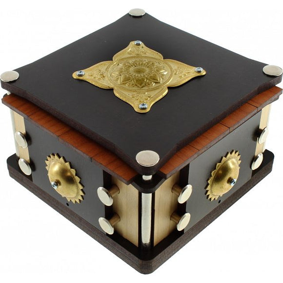 The Find Your Sun Box by Jean Claude is an intricate mechanical puzzle box featuring a detailed golden emblem on the lid. Crafted from dark wood with brass accents, it has multiple interactive elements such as cogs and buttons, enhancing its puzzle challenge. This stylish box combines art and engineering, offering a unique tactile experience as you work to discover its secrets.