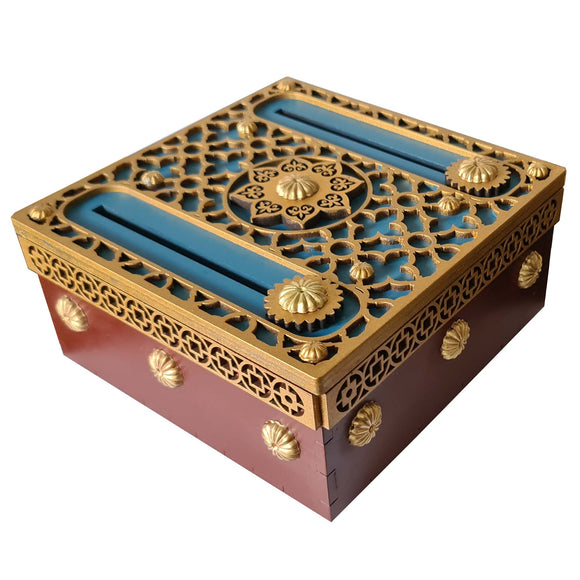 The Blue Dragon Box is an intricately designed mechanical puzzle featuring a captivating blend of gold and blue accents. The box showcases delicate filigree patterns and ornate details, with a smooth, rich red base. Perfect for puzzle enthusiasts and those who appreciate unique craftsmanship.