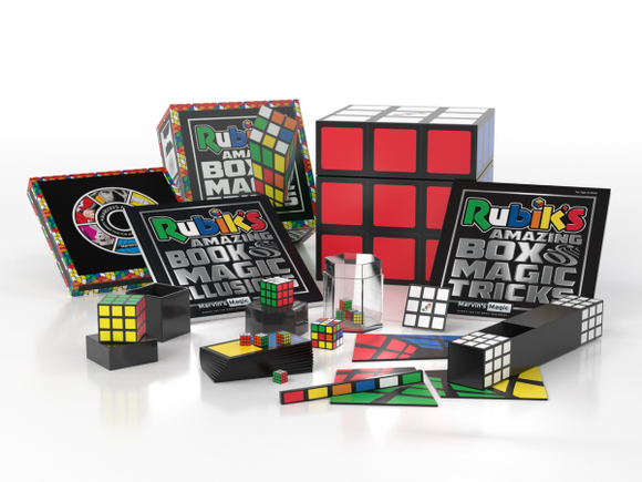 A colorful Rubik's Cube Magic Set by Marvin's Magic, displaying various magic props, including a Rubik's cube, magic trick books, and illusion kits, arranged on a white surface.