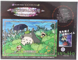 Ensky's 'Steadily Though the Field Crys' jigsaw puzzle featuring vibrant artwork of characters from 'My Neighbor Totoro', with 300 interlocking pieces designed for an engaging building experience.