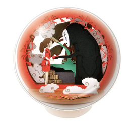 A beautifully crafted Paper Theater Ball featuring No Face and a girl in a red dress, set against a vibrant red and black background. The intricate layers of paper create a 3D scene reminiscent of classic animated stories.